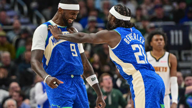 Milwaukee Bucks forward Bobby Portis (9) celebrates with guard Patrick Beverley (21)
